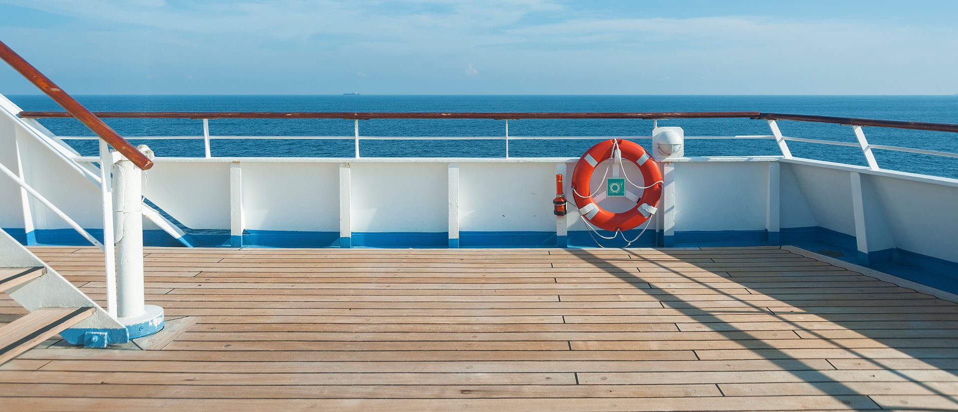 Ship deck, buoy and blue ocean