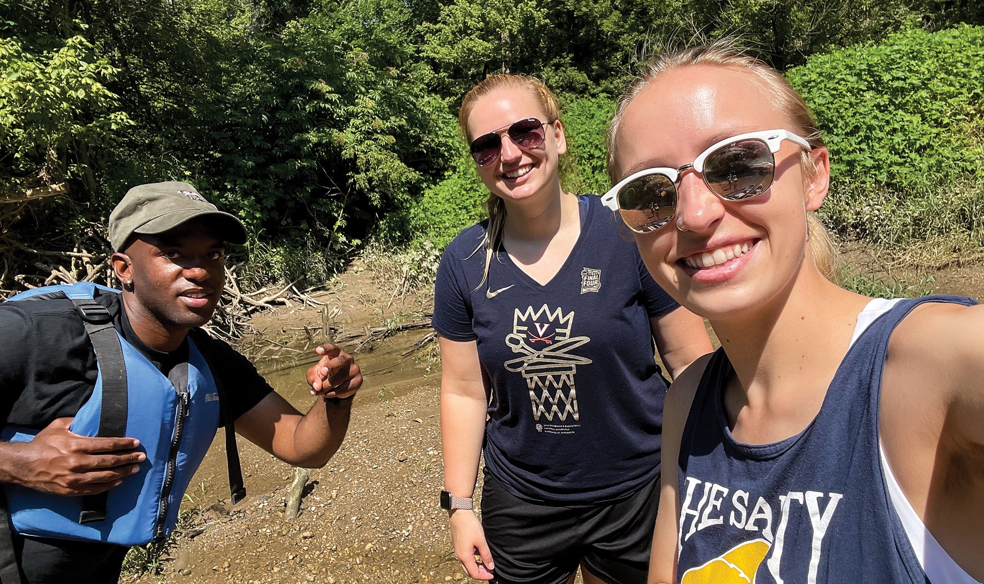 Randi Swanson, far right, takes a selfie with AFRL research materials engineer Katie Detwiler and materials research intern Tyriek Craigs