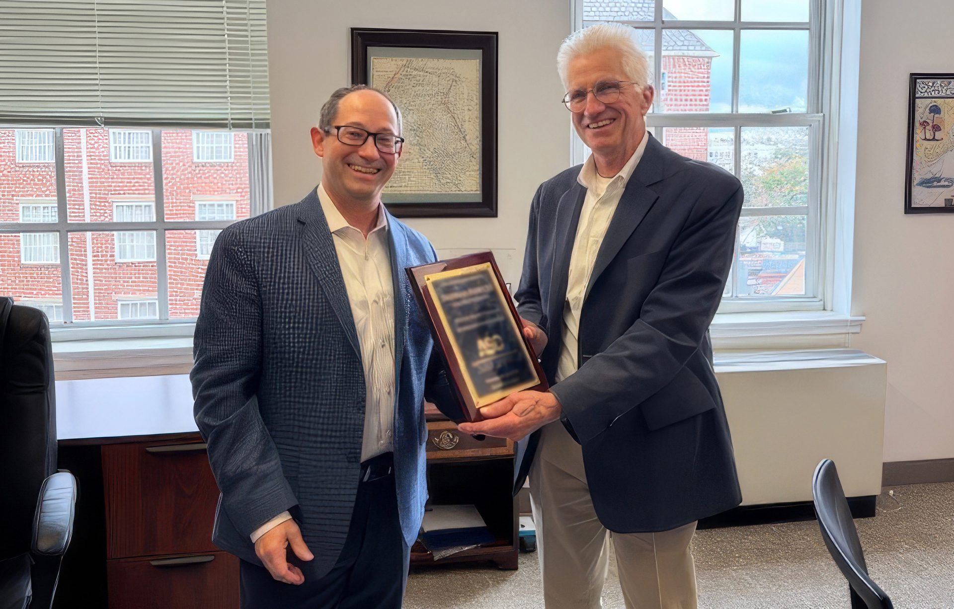 Tom Fowler receives recognition from the Adhesives and Sealant Council, October 2025.