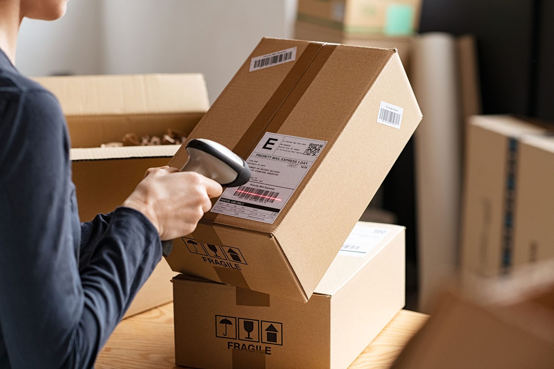 Person scanning a label on a package