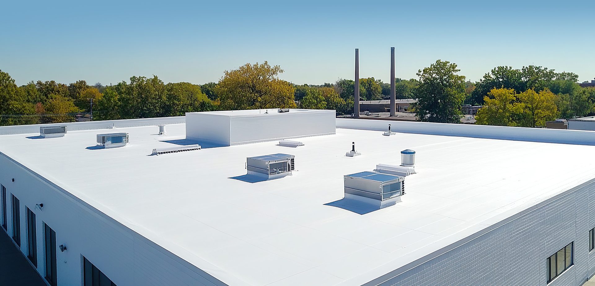 White two-story flat roof commercial building