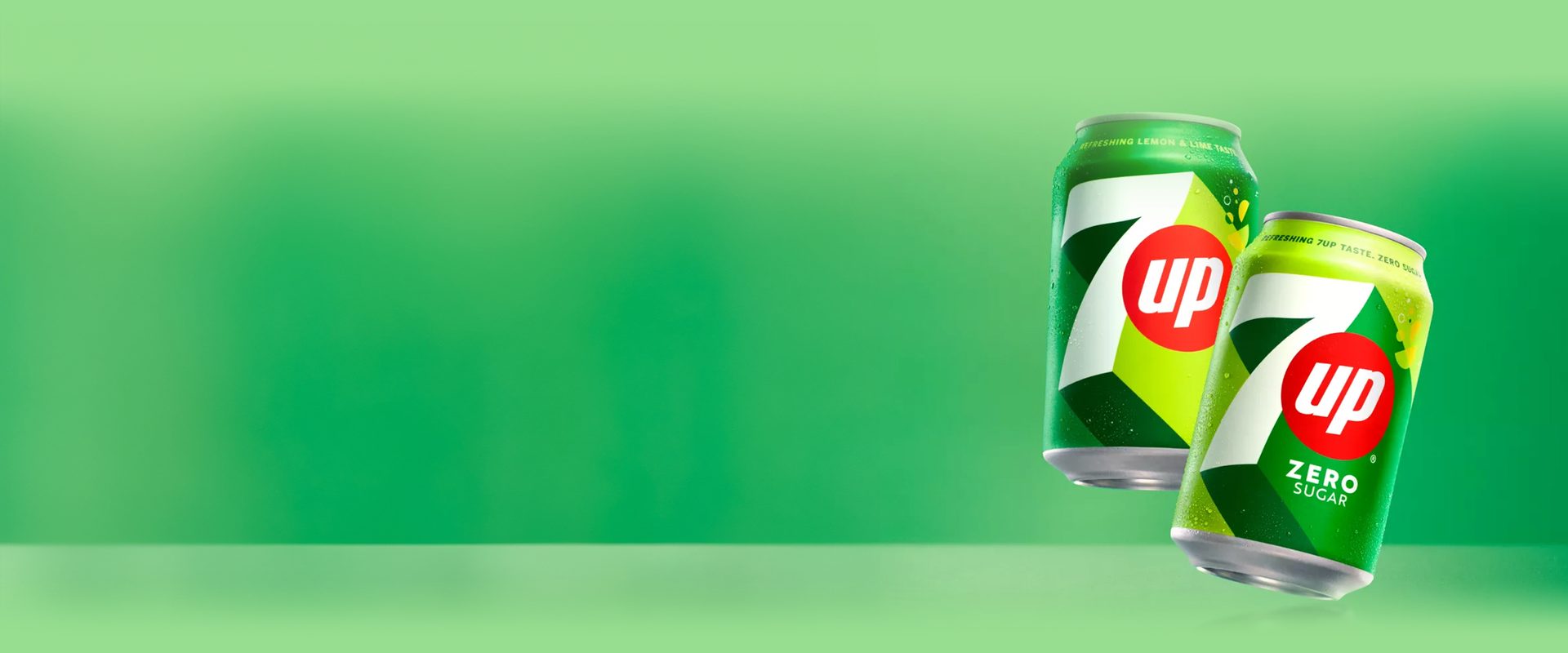 7UP cans in angled succession against green background