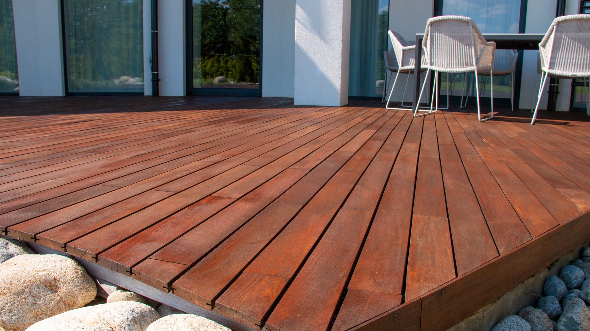 Wood deck, modern house design with wooden patio, low angle view of tropical hardwood decking