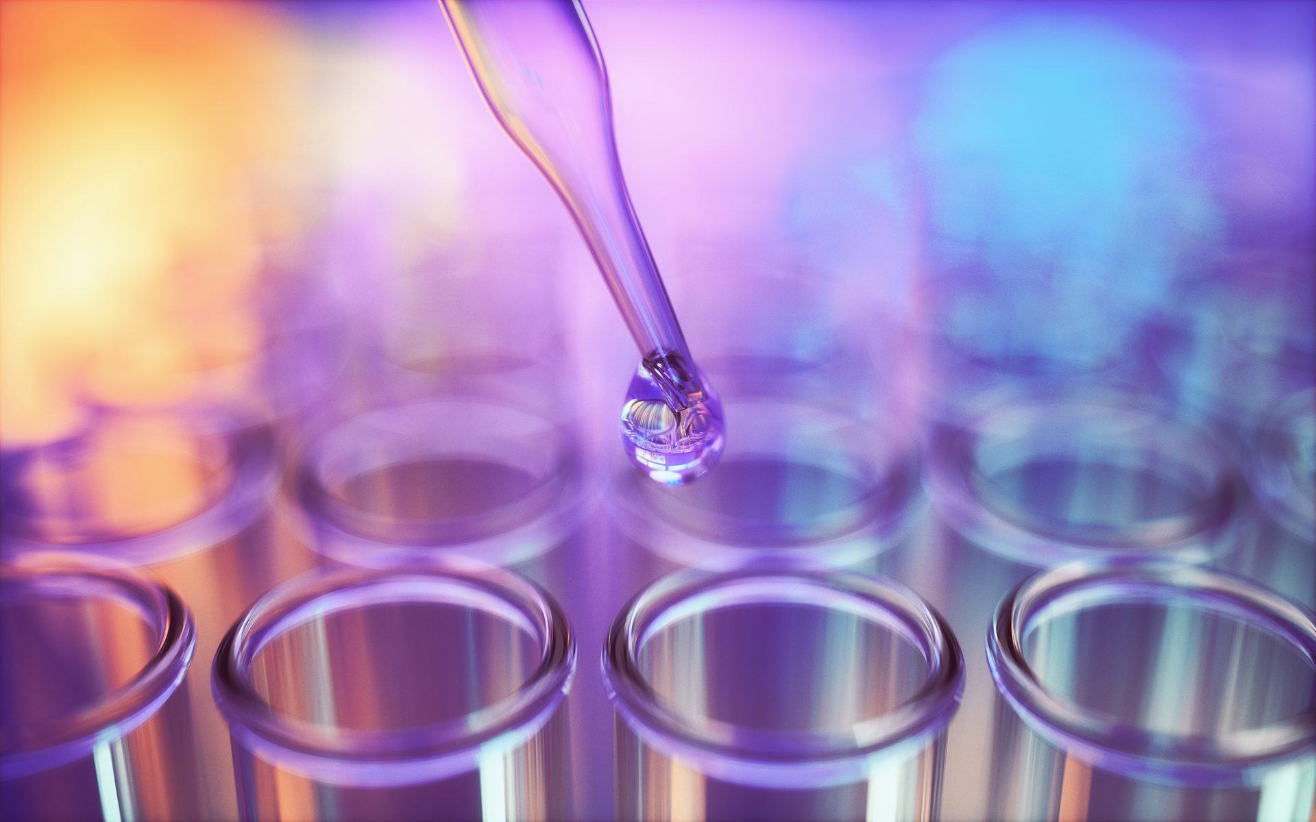 Dropper with liquid drop over test tubes, vibrant colors.