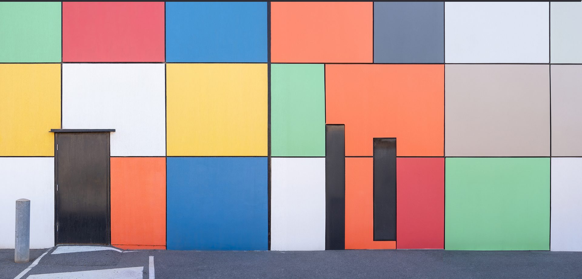 Exterior wall painted with blocks of vibrant colors