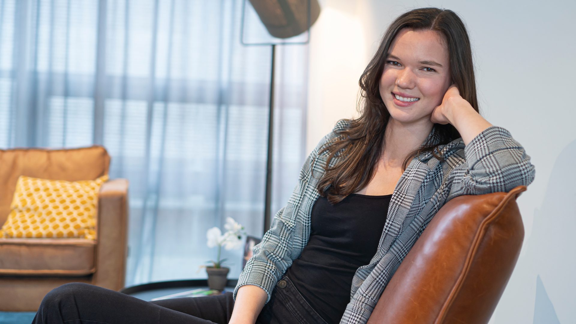 Facial expression, Smile, Furniture, Shoulder, Comfort, Dress, Thigh, Curtain, Chair