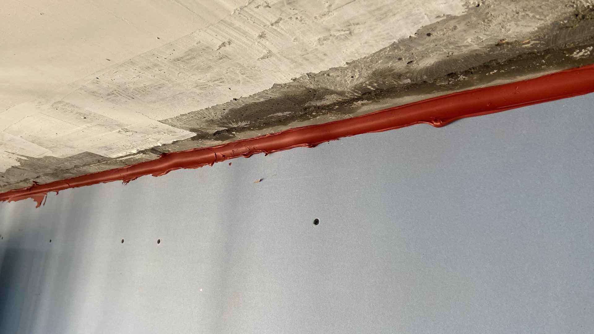 First-generation firestopping sealants applied to the top-of-wall