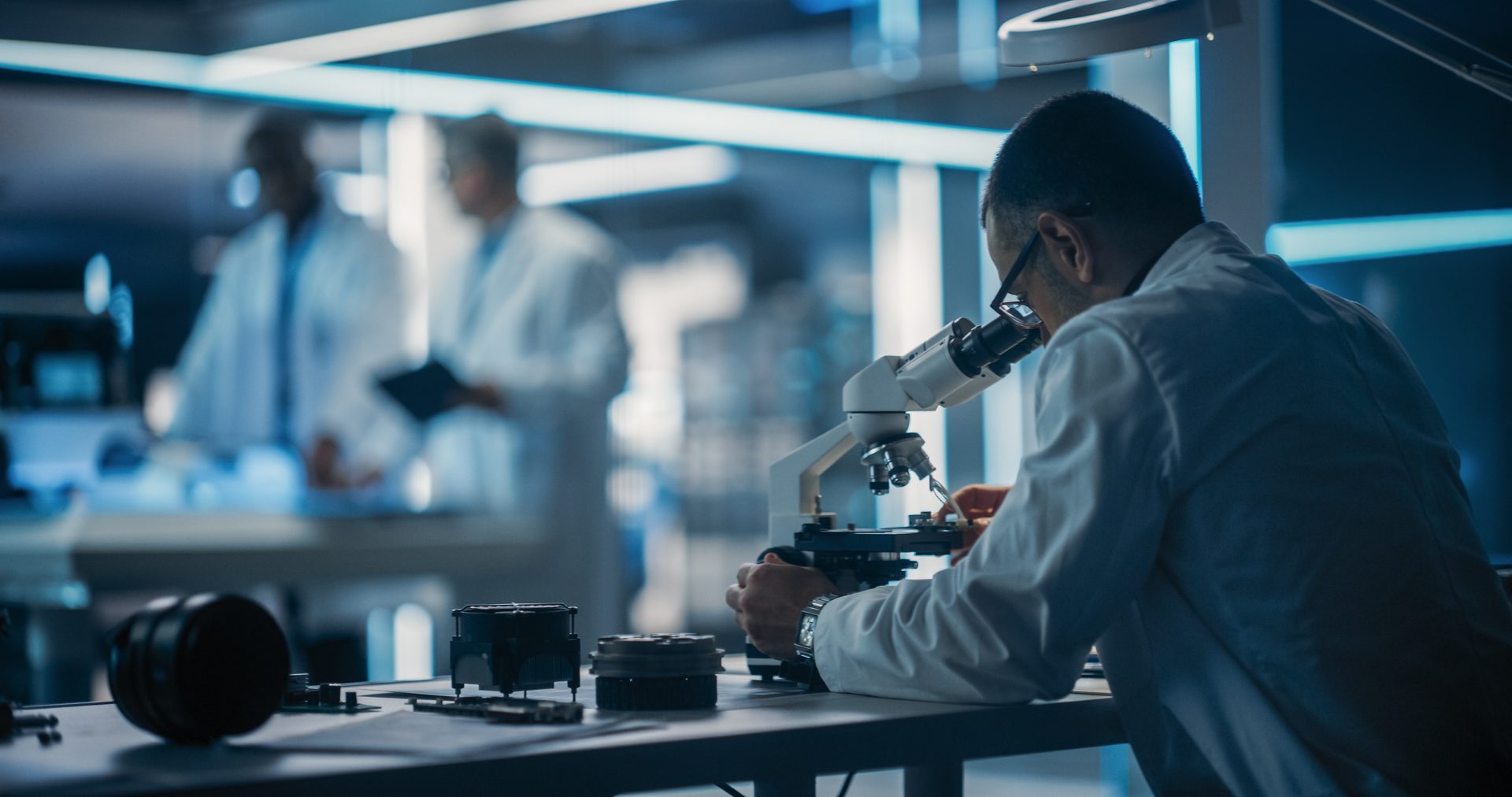Man looking through microscope