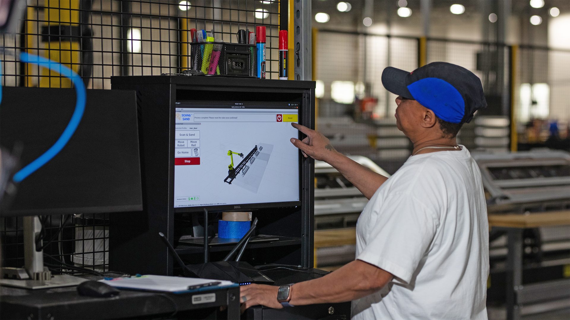 worker using touchscreen with 3D model