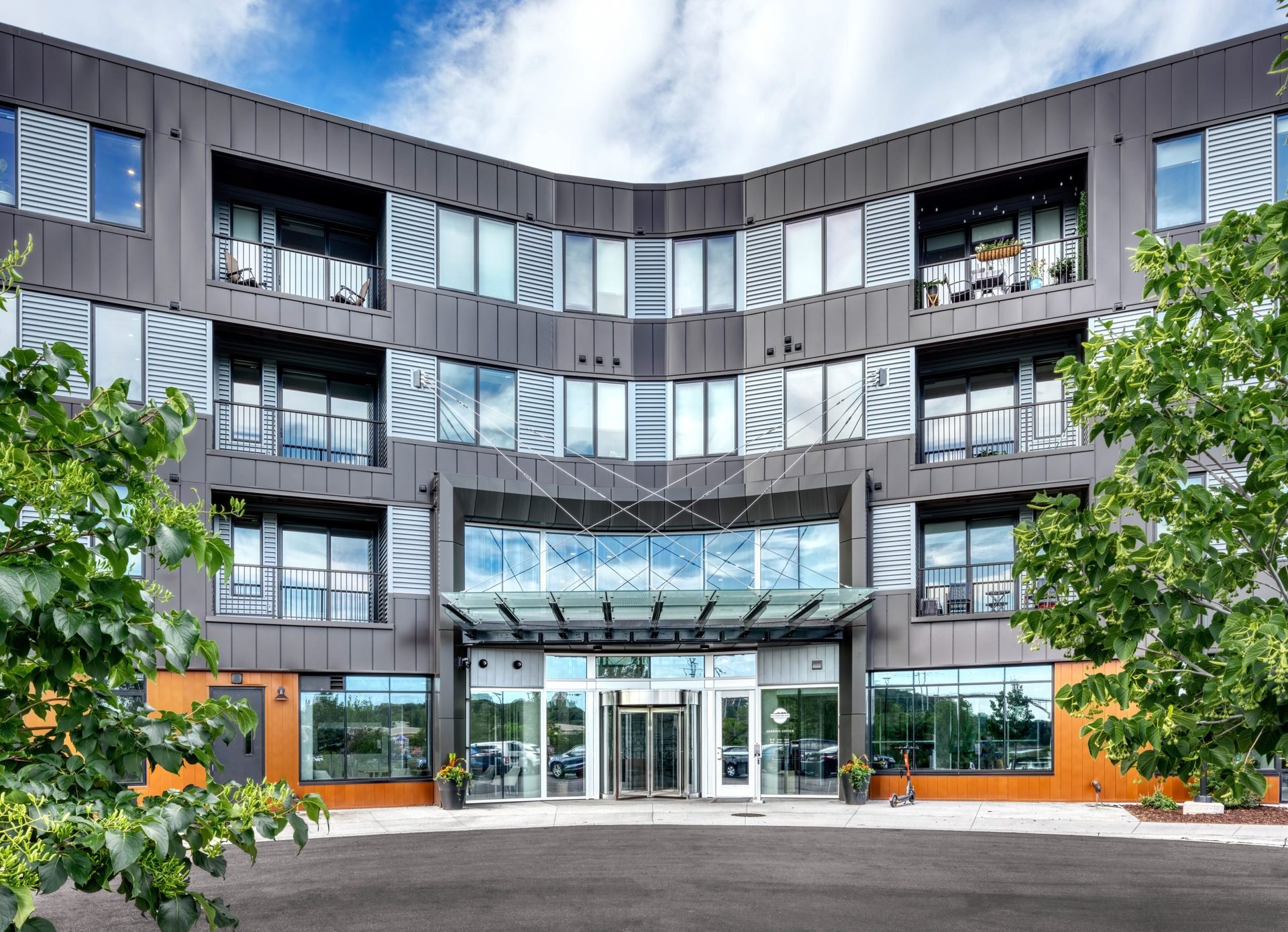 New Metal-Clad Apartment Complex Brings Public Access to Riverfront