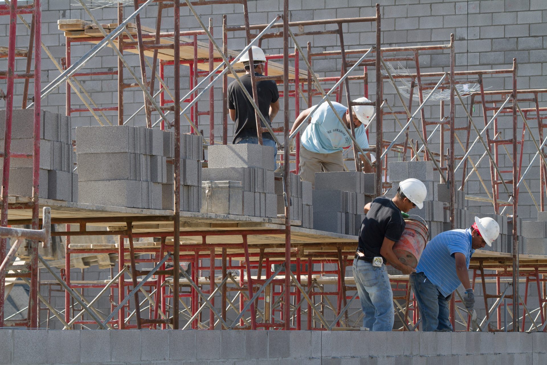 Workers installing Concrete Masonry Units 