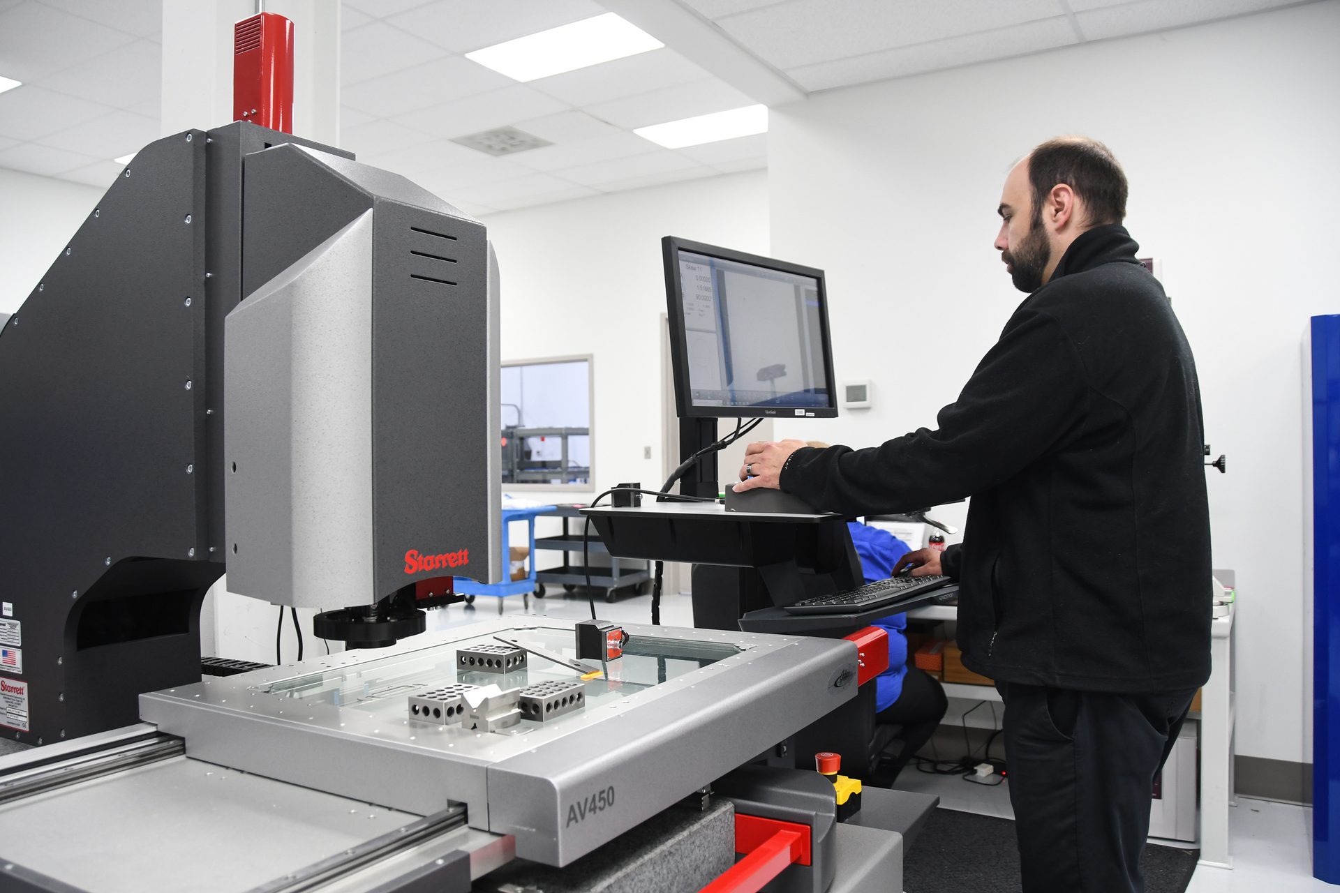 Ryan Osborne performs first article inspection on the Starrett AV450 vision system