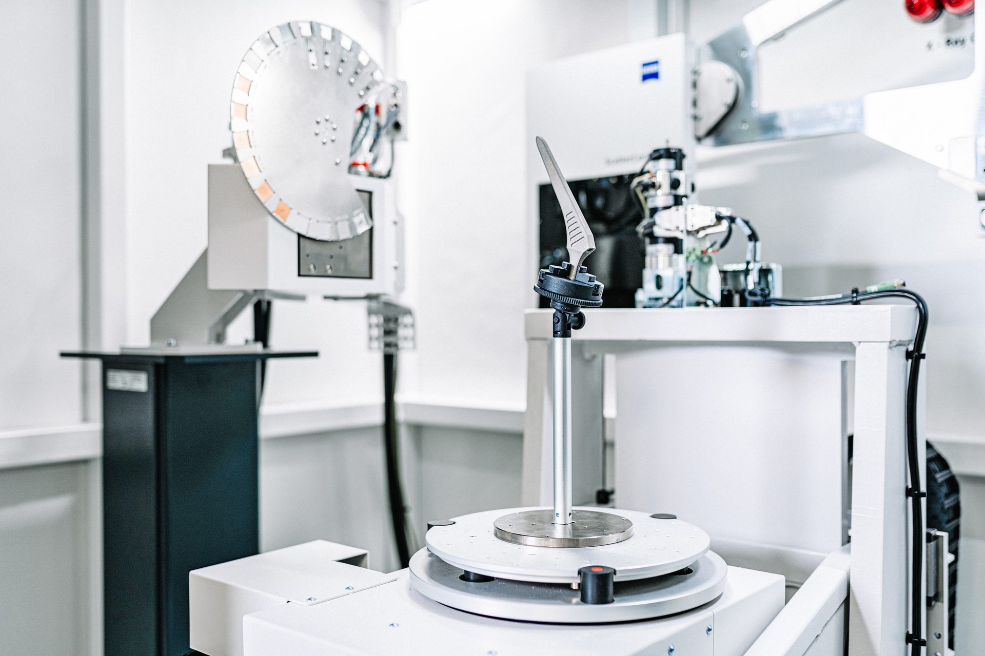 Metal medical implant on a rotating stage within a Zeiss industrial X-ray inspection system.