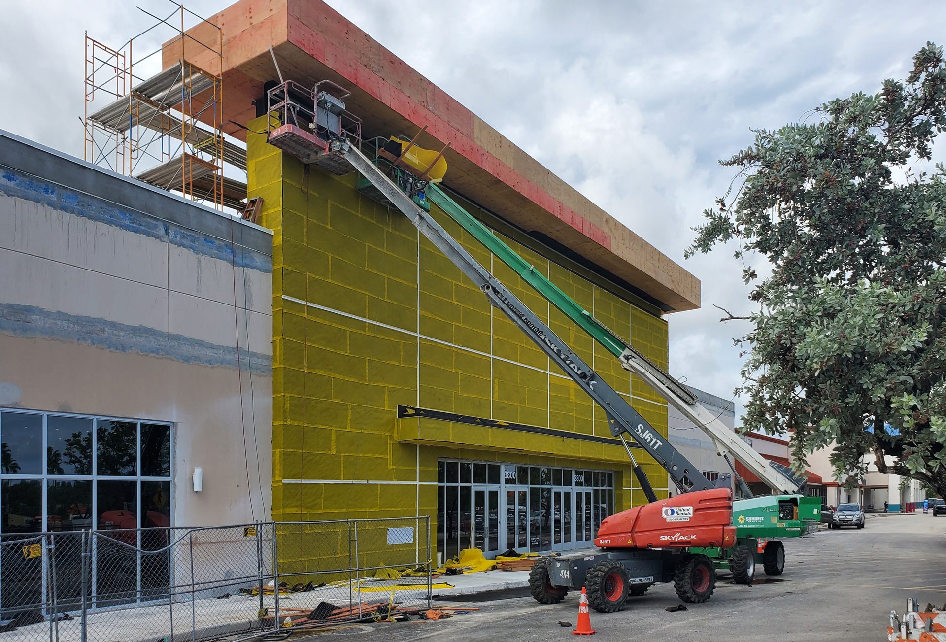 Cranes installing building facade