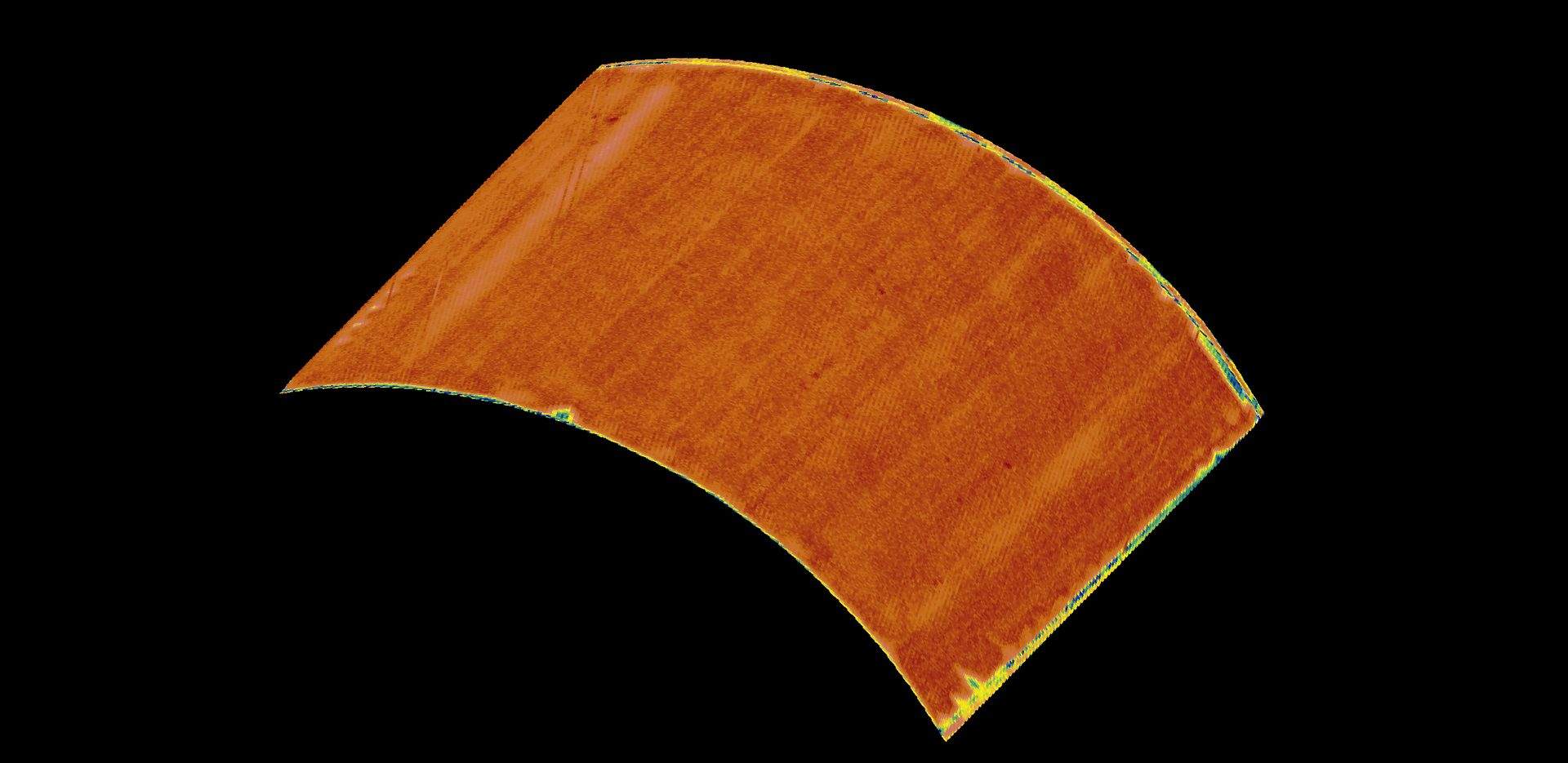 A curved, orange, textured object with colorful edges on a black background.