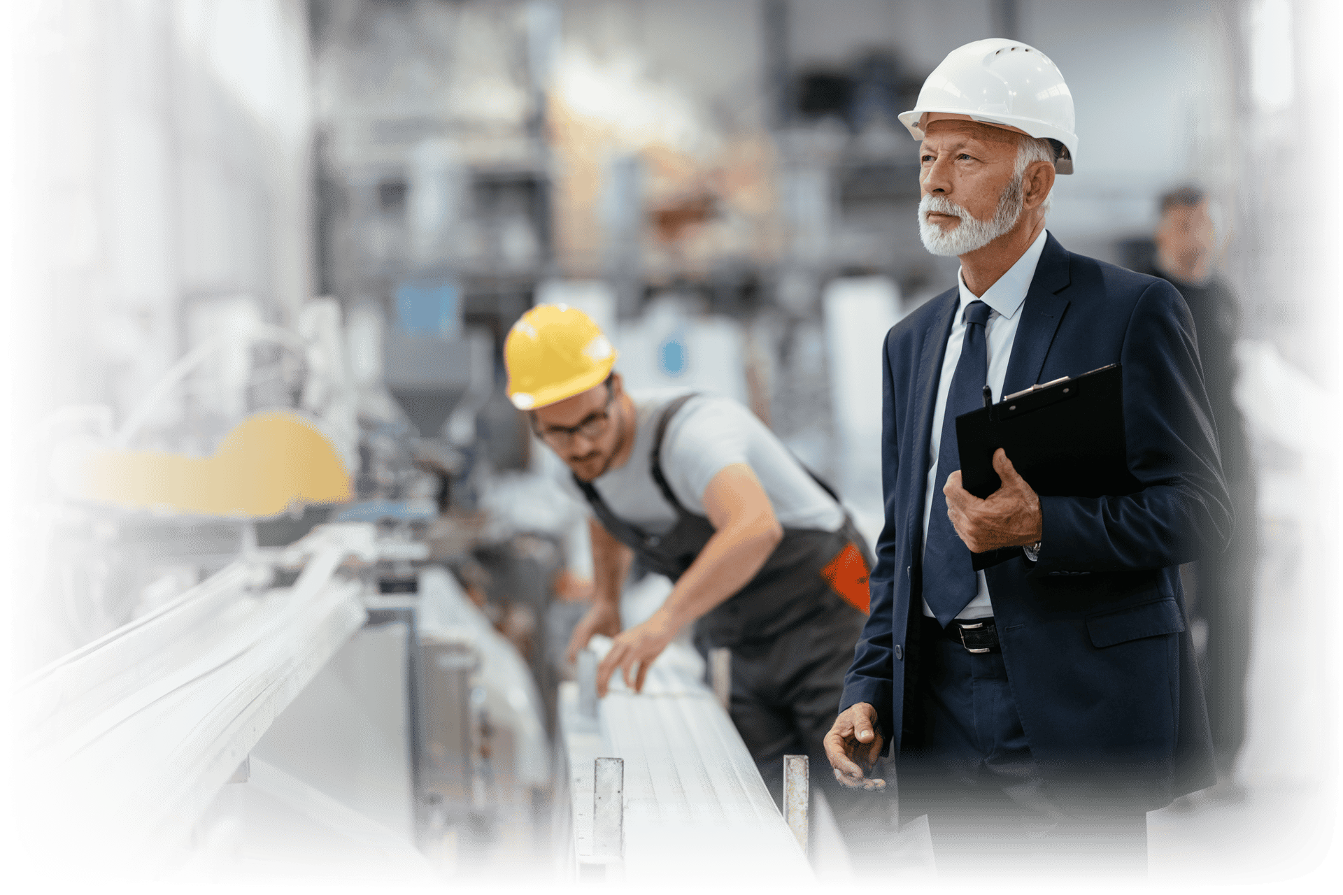 Older manager watching over factory worker
