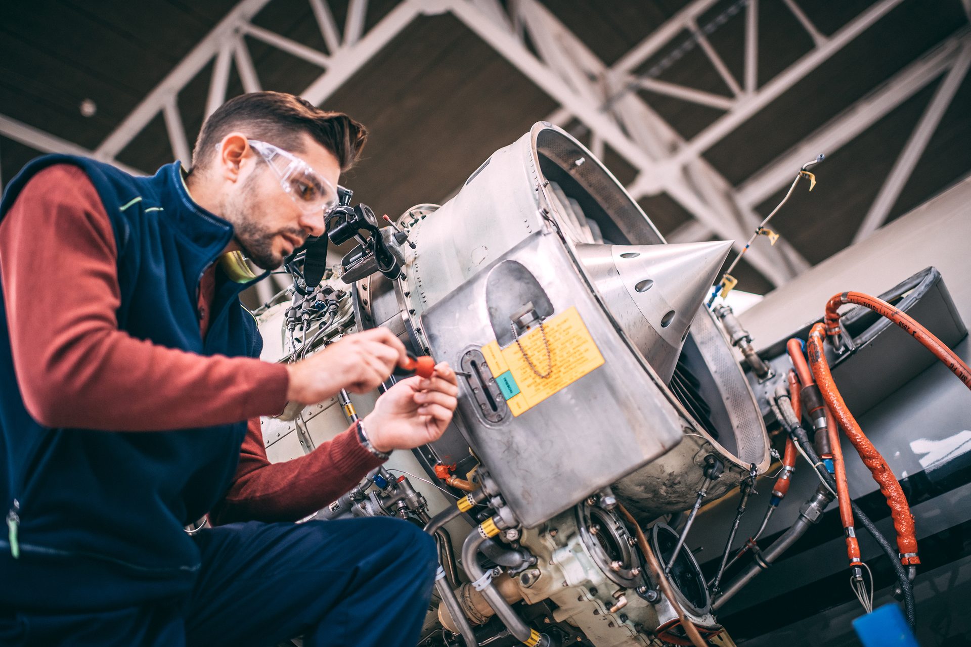worker inspecting turbine