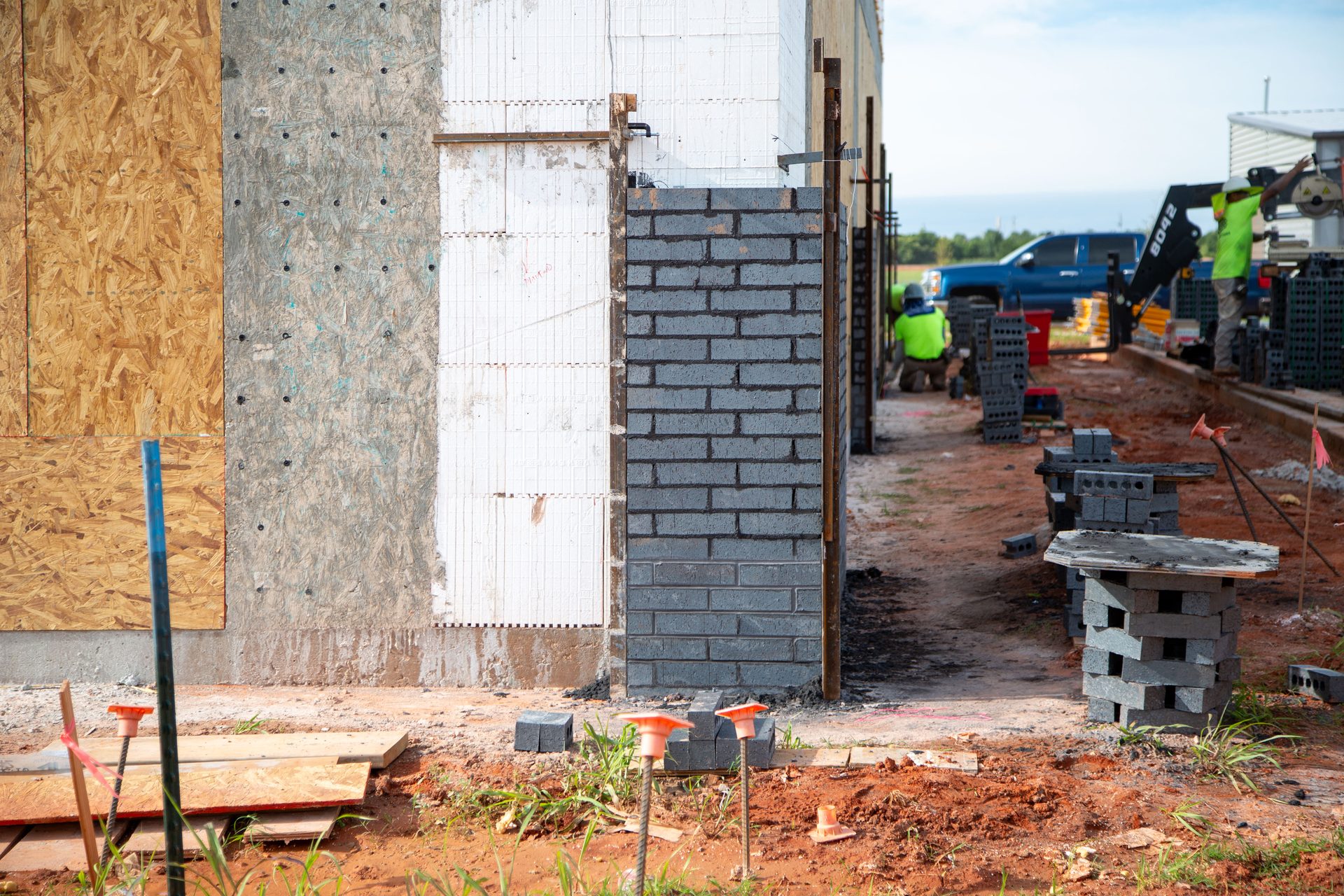 Installers Beginning To Place Brick Exterior