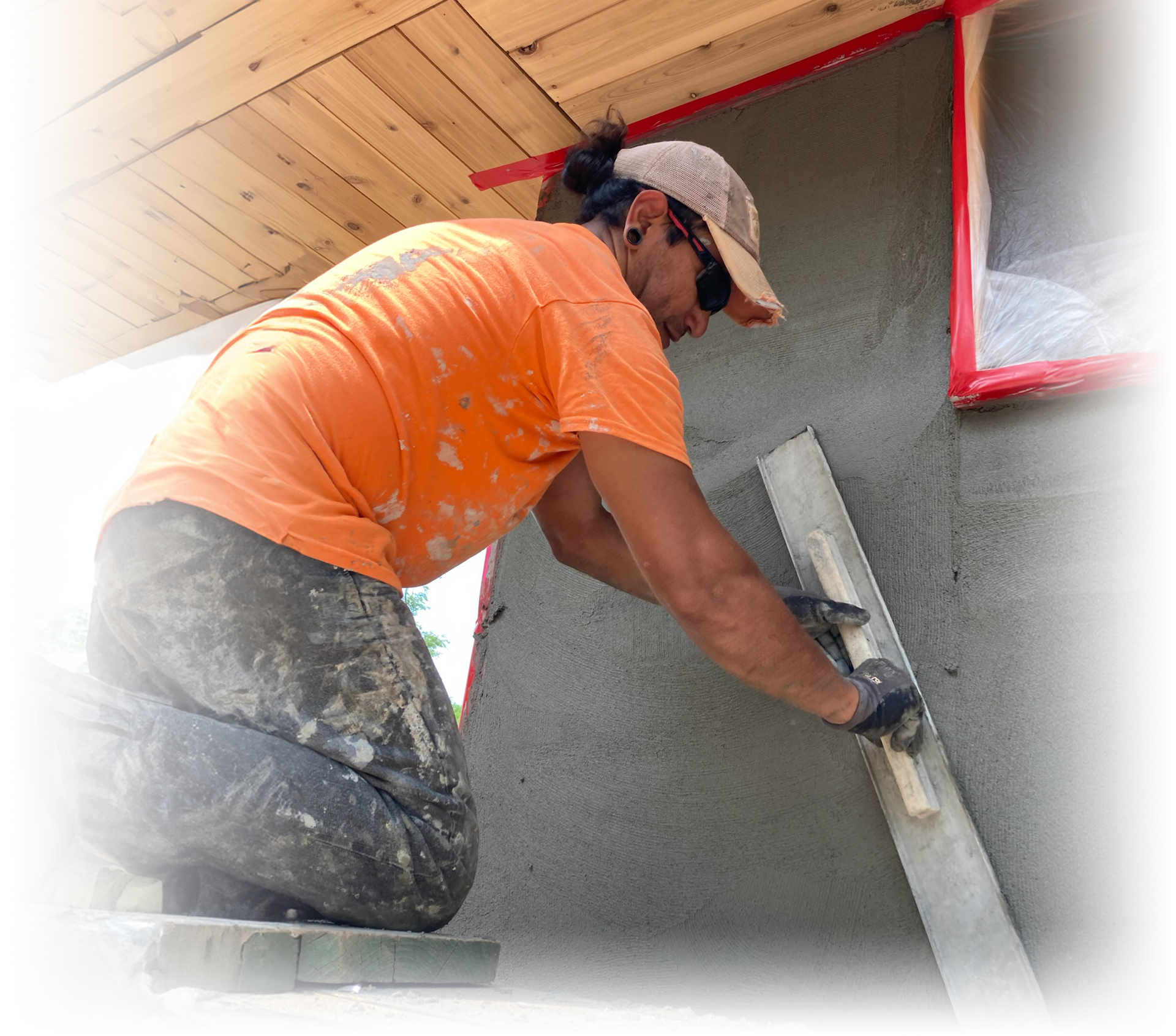 Worker applying stucco
