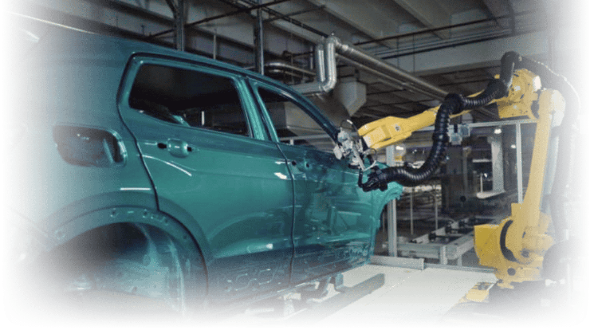 A THz sensor mounted on a robotic arm inspecting paint quality of a car on a production line 