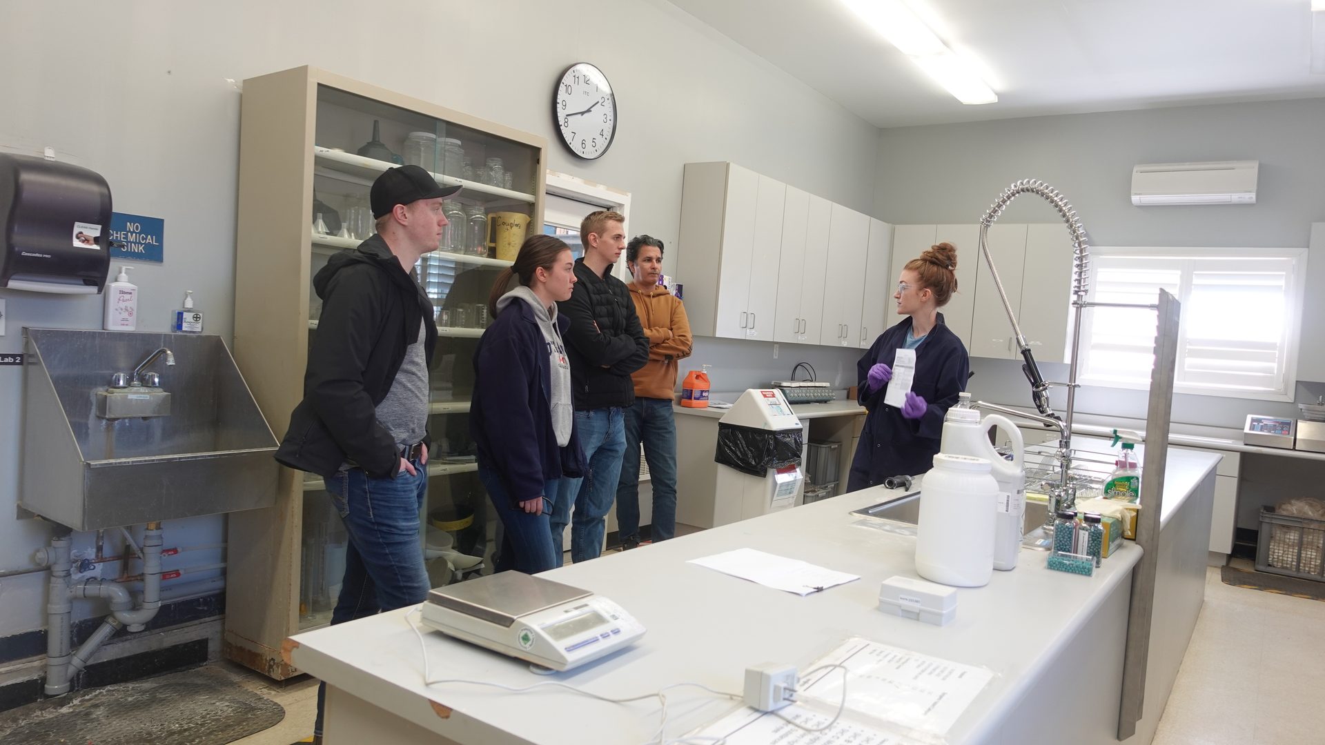 A Syngenta employee speaking to other employees on a tour of Honeywood Research Farm facility