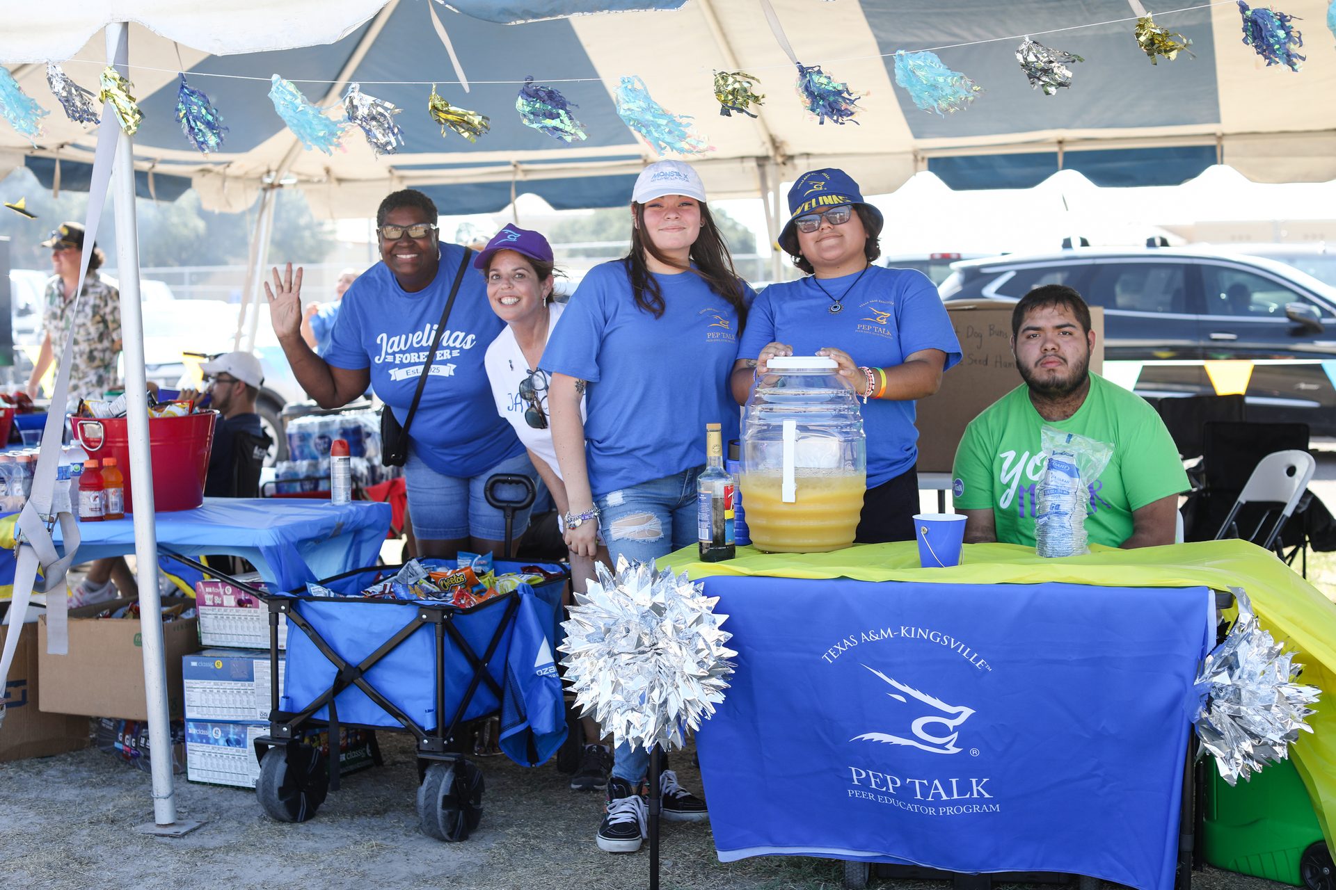 Students posing at homecoming tailgate safety event