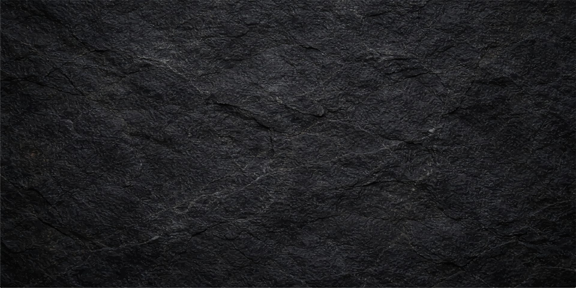 A dark, textured surface resembling natural stone or slate, with subtle variations in shade.