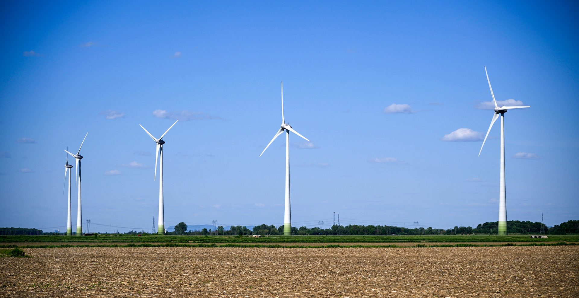 Wind farm, Natural environment, Sky, Windmill, Atmosphere, Ecoregion, Light, Nature, Black