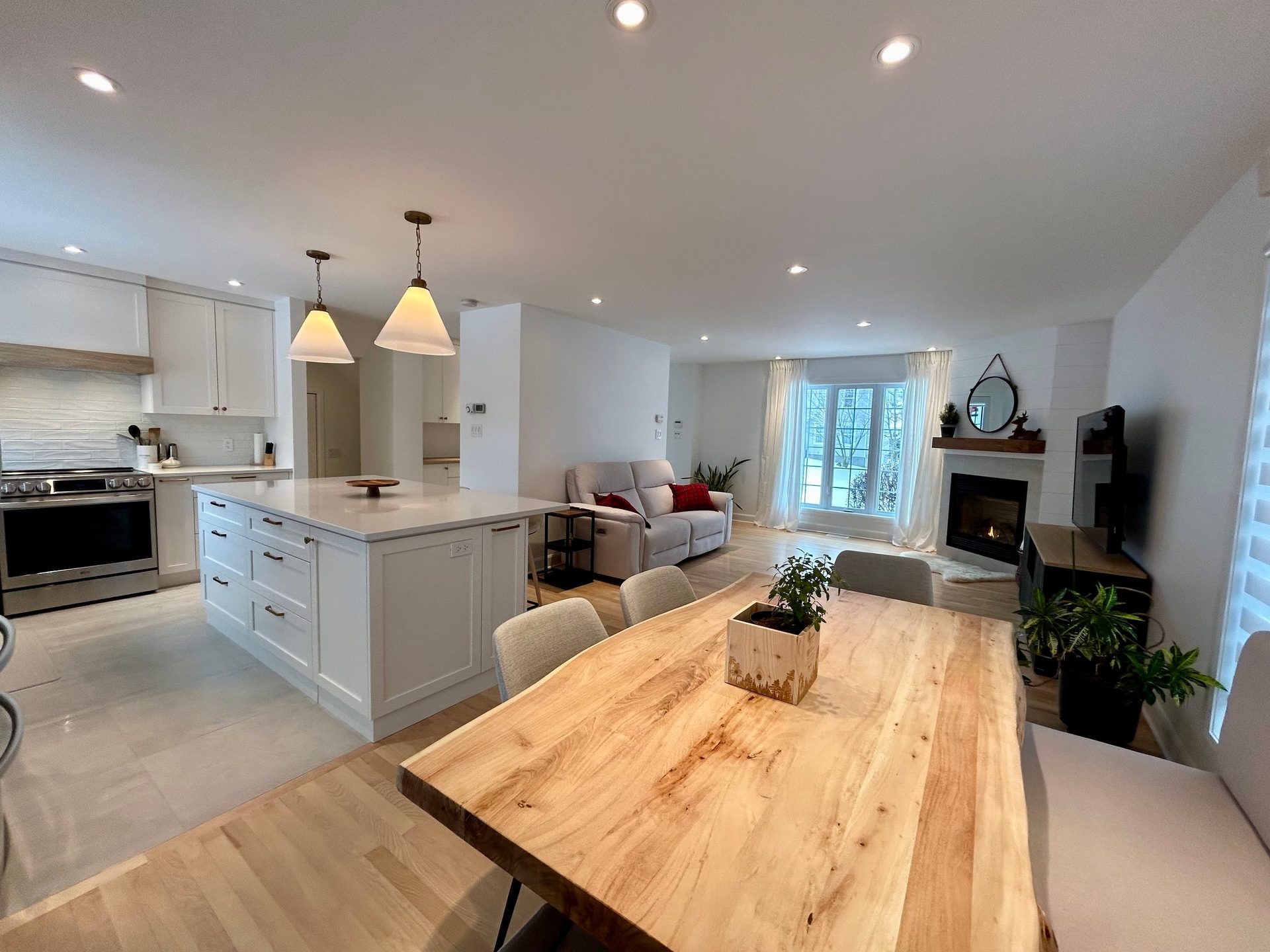 Interior design, Kitchen appliance, Table, Furniture, Cabinetry, Countertop, Plant, Wood, Chair, Lighting