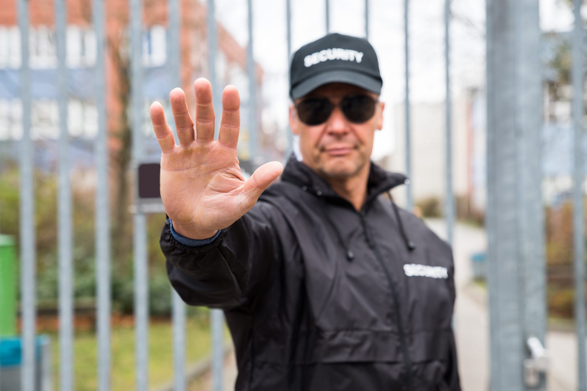 Vision care, Baseball cap, Hand, Sunglasses, Sleeve, Goggles, Gesture, Eyewear
