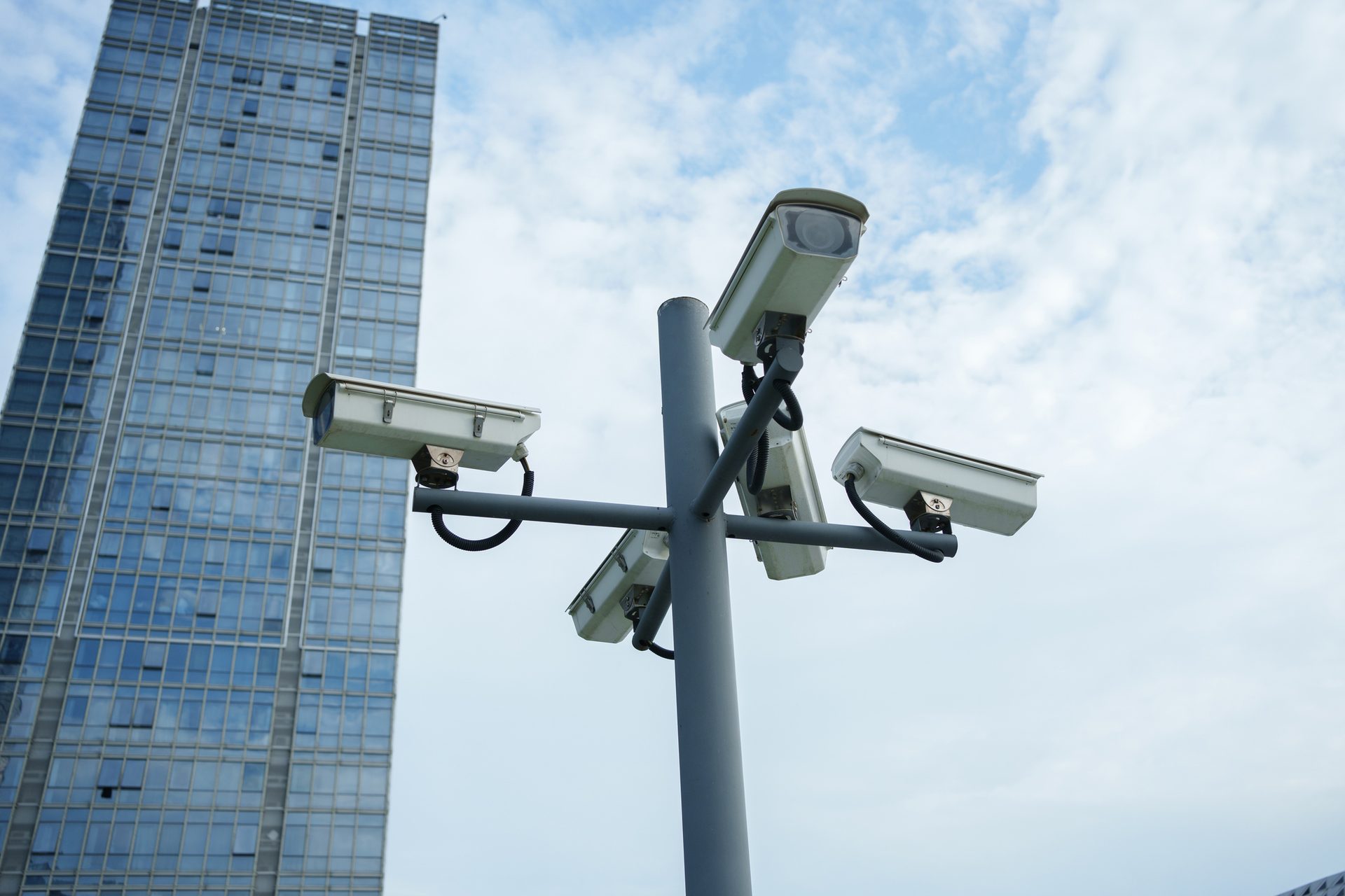 Surveillance camera, Street light, Cloud, Sky, Building, Skyscraper, Floodlight
