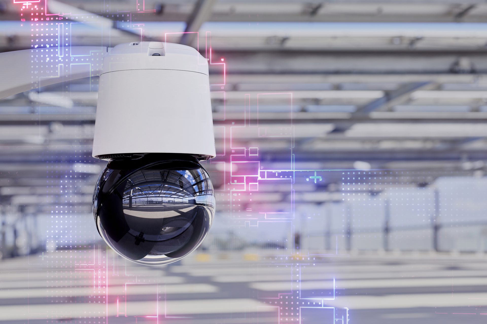 White CCTV camera with reflective dome, glowing digital overlay, blurred industrial background.