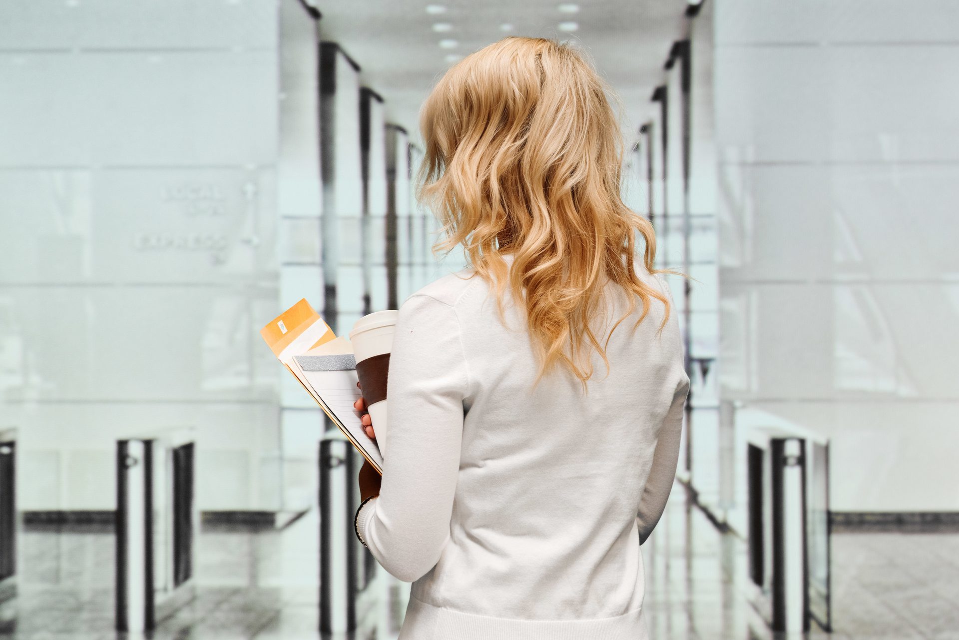 Rear view of businesswoman standing in office