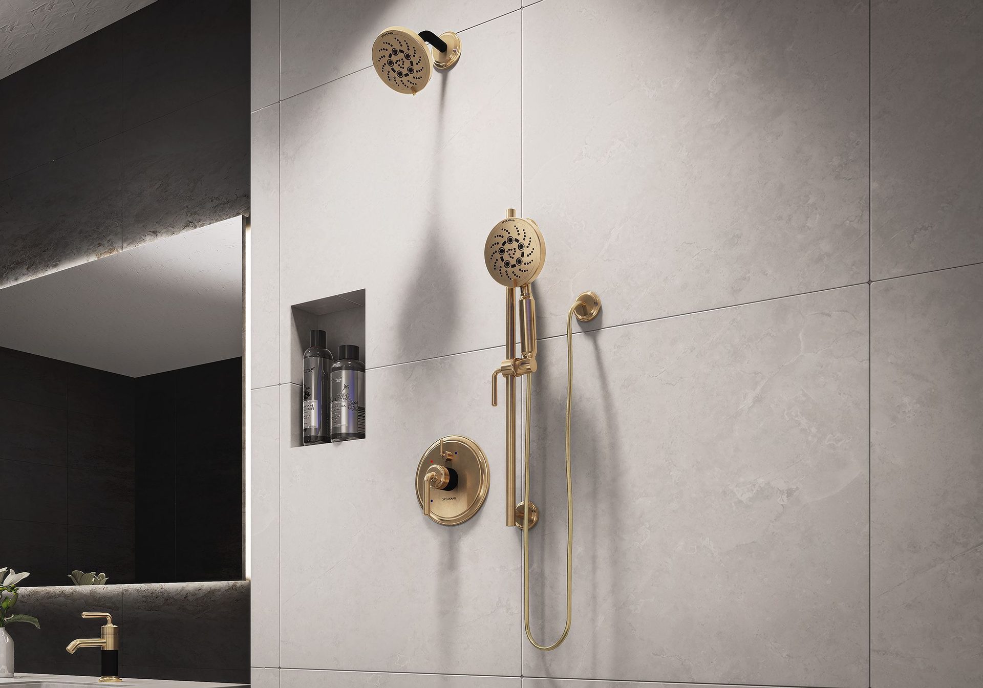 Modern bathroom with gold shower fixtures and light grey tiles.