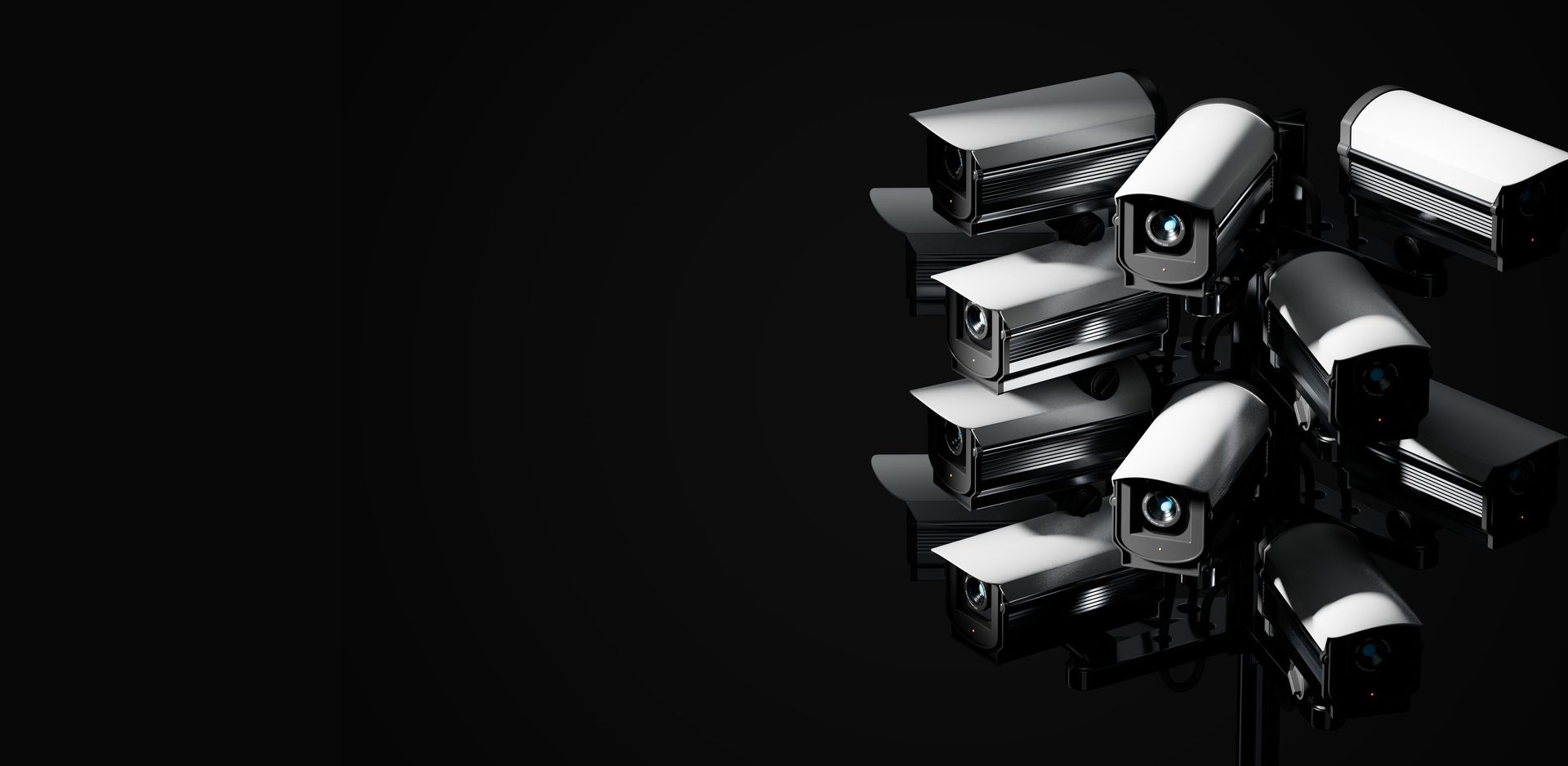 A cluster of white and black security cameras against a dark background, emphasizing surveillance.