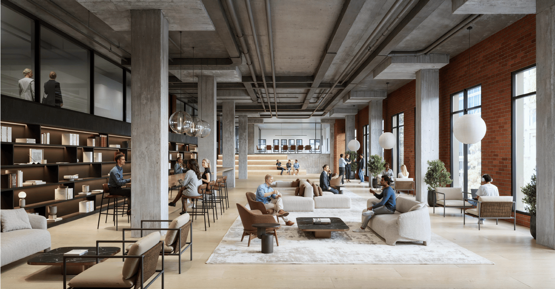 Modern industrial-chic co-working lounge space with people working and relaxing.