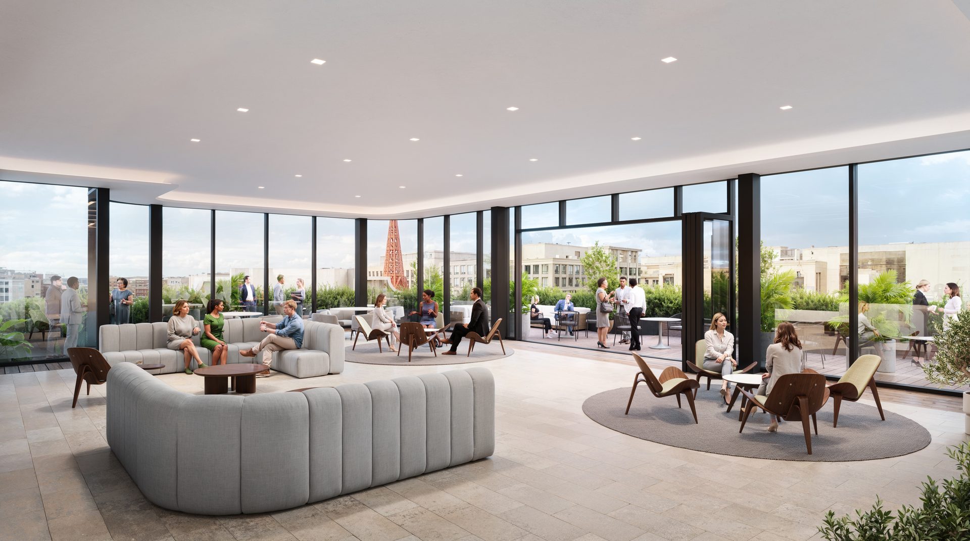 People interacting in a bright, modern lounge with floor-to-ceiling windows and an outdoor patio.