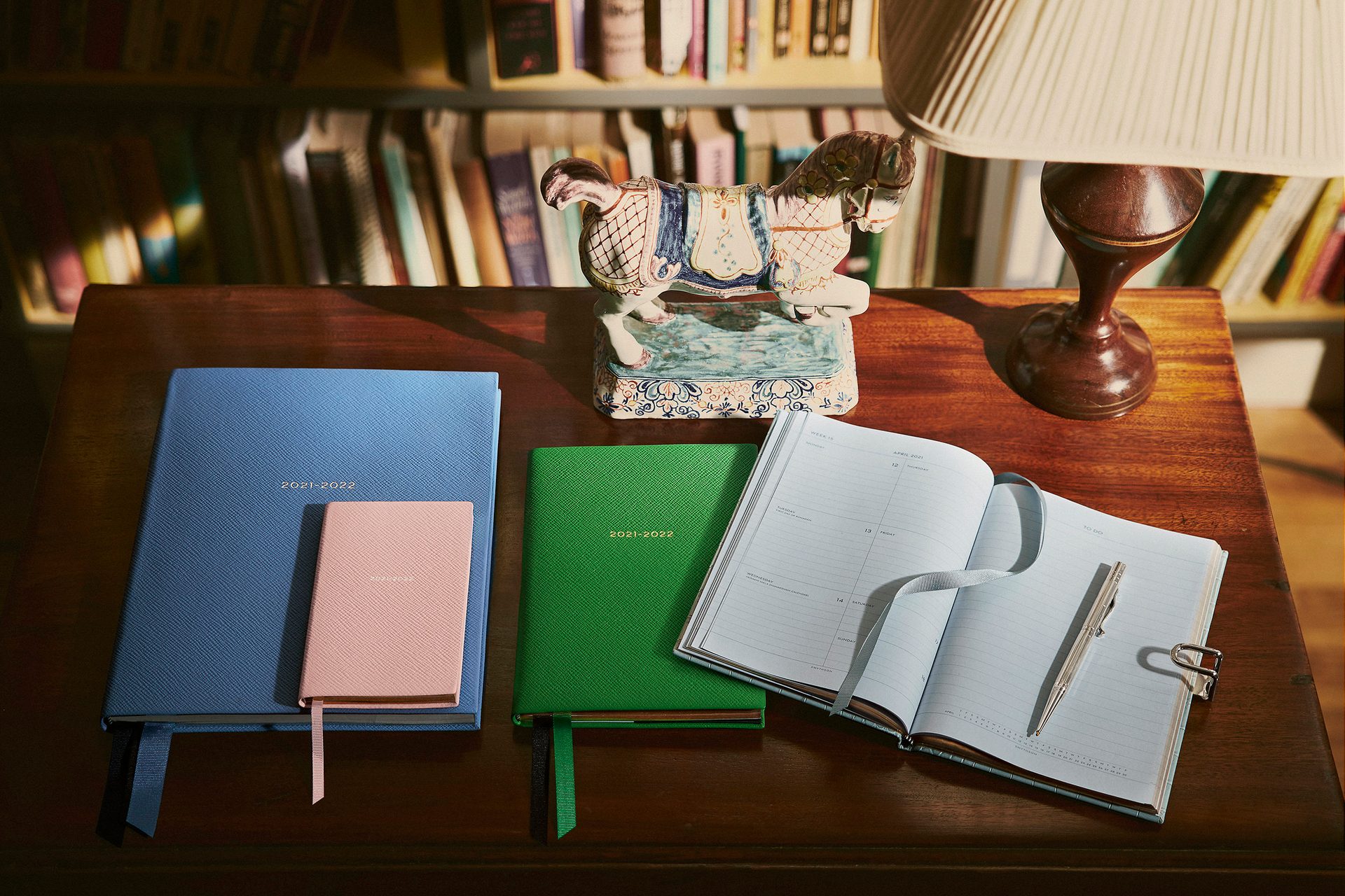 Interior design, Living room, Furniture, Table, Rectangle, Wood, Dishware, Book