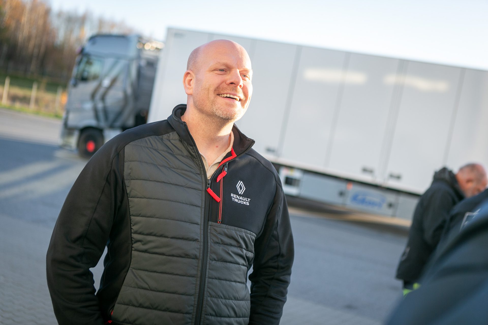 Motor vehicle, Automotive design, Outerwear, Smile, Sleeve, Sky, Asphalt