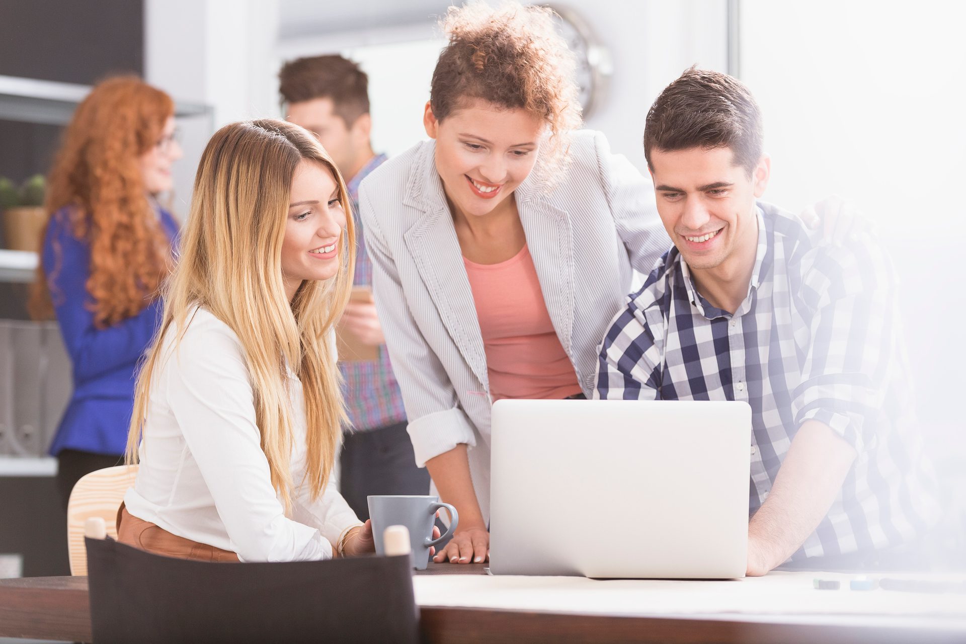Personal computer, Social group, Smile, Laptop, Table