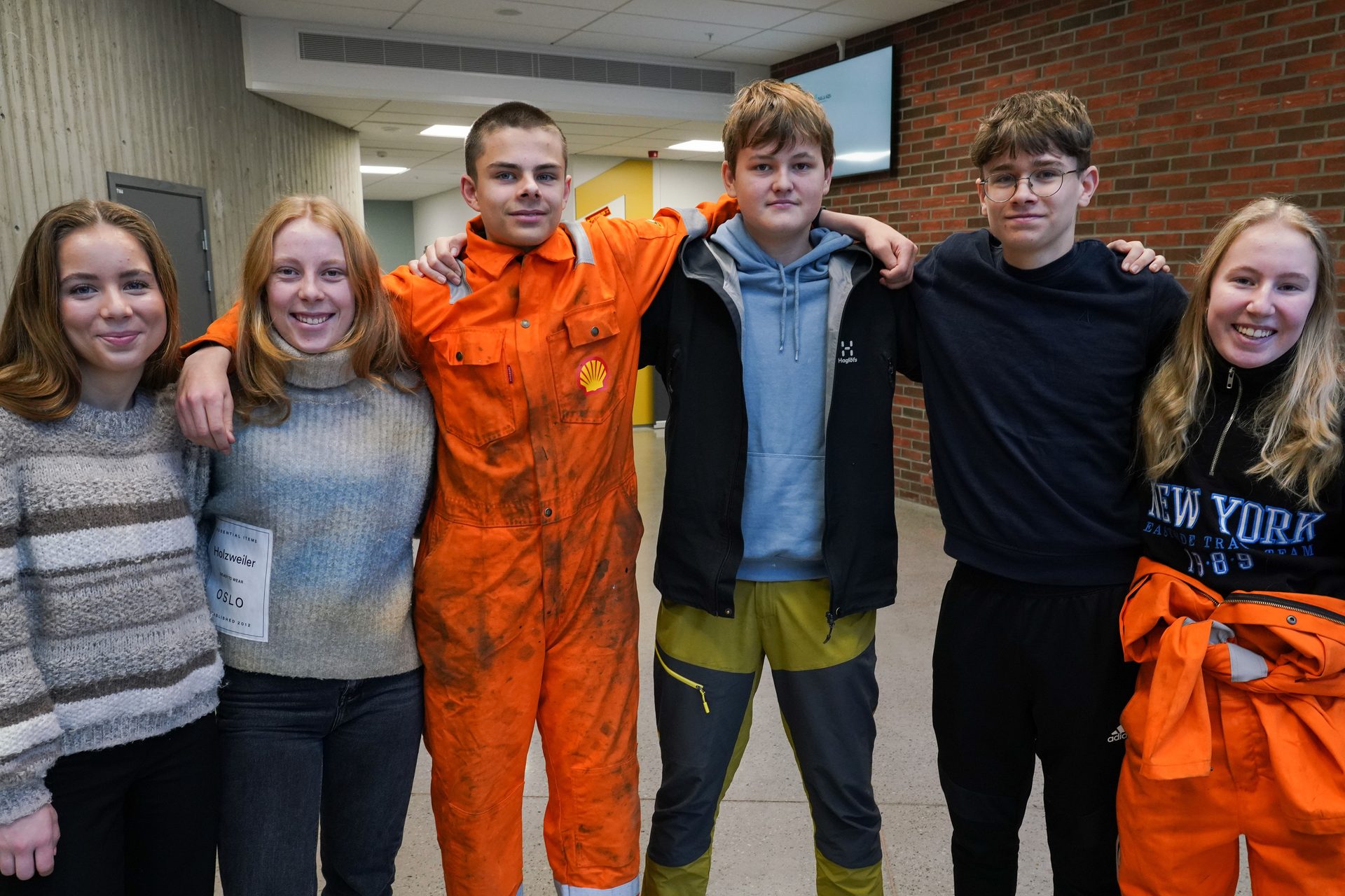 Social group, Smile, Outerwear, Workwear, Orange, Community