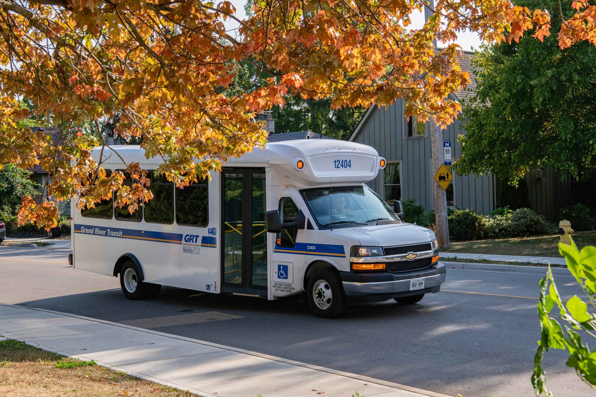 GRT mobility bus driving on a street in the fall