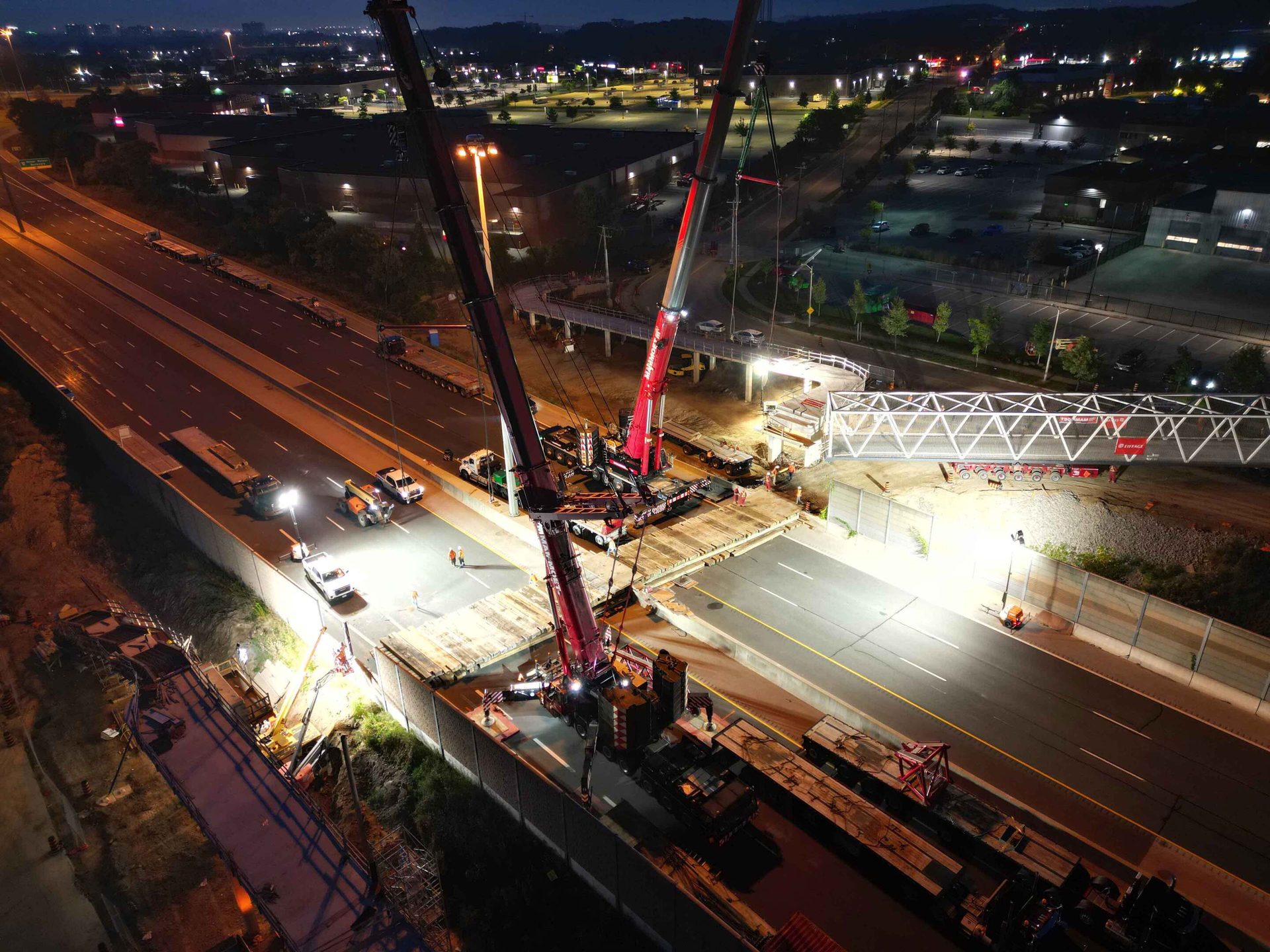 Nighttime scene of the pedestrian bridge installation