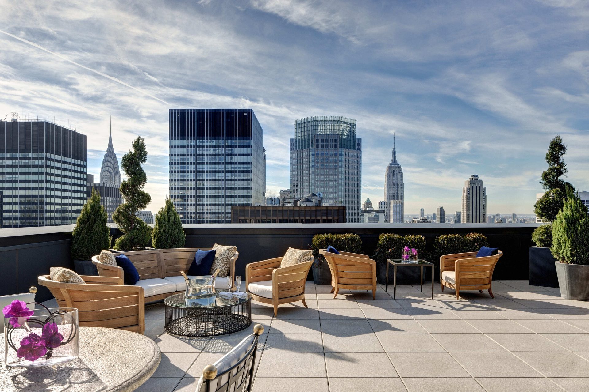 Tower block, Outdoor furniture, Urban design, Cloud, Building, Sky, Skyscraper, Property, Table, Tree