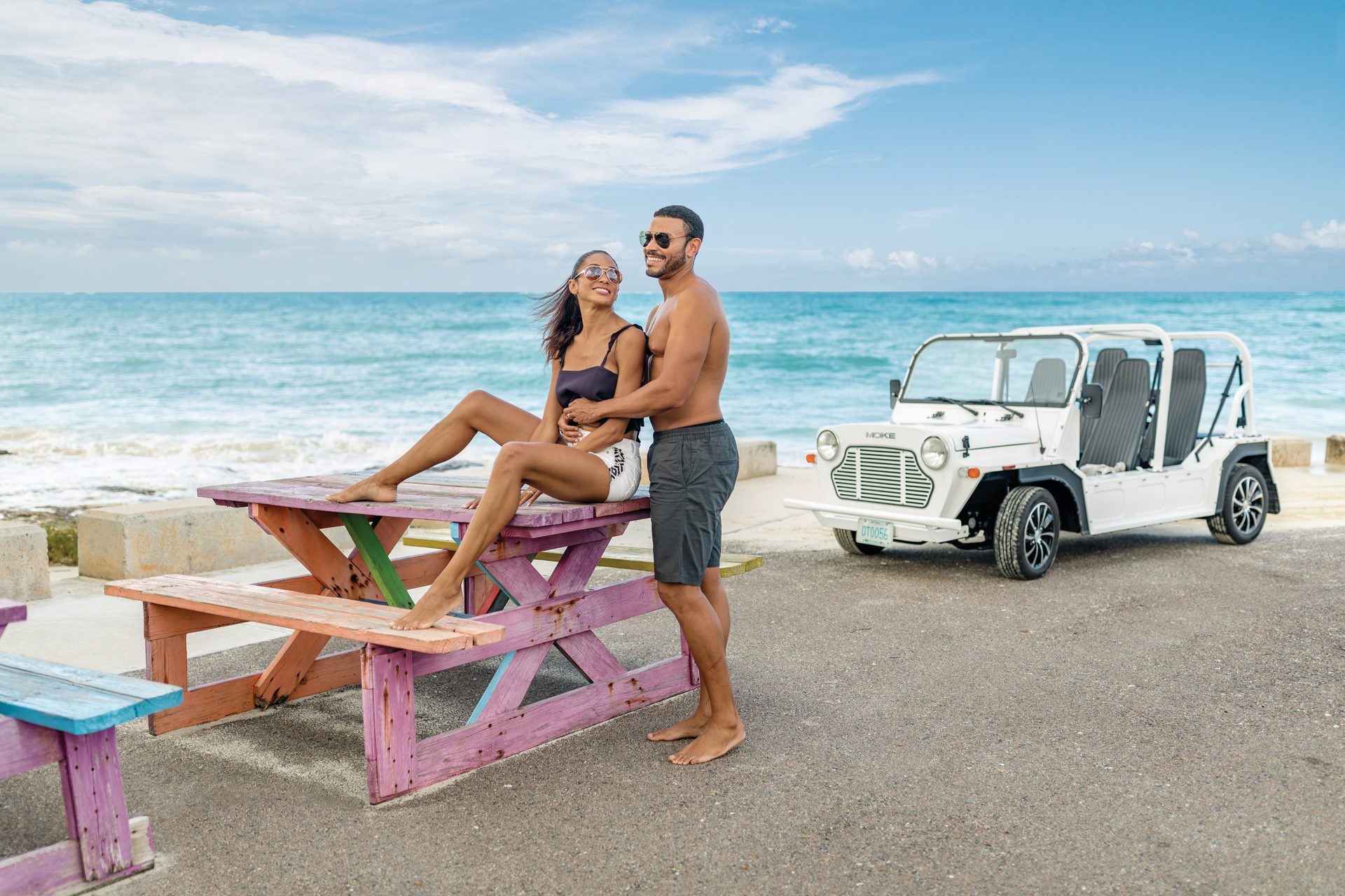 Automotive tire, Outdoor furniture, Water, Cloud, Sky, Wheel, Vehicle, Shorts, Sunglasses