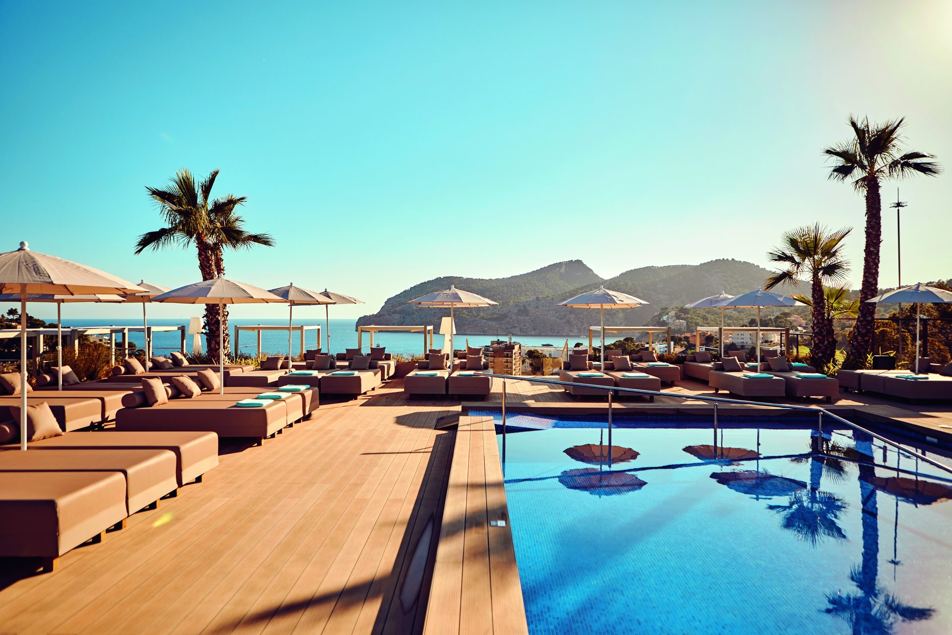 Outdoor furniture, Swimming pool, Eco hotel, Resort, Vacation, Umbrella, Sea