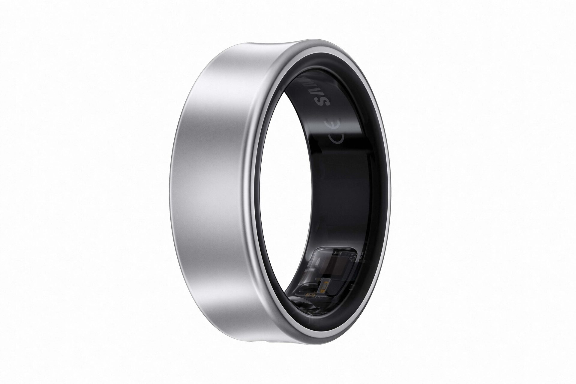 A silver and black smart ring on white, showing its internal tech.