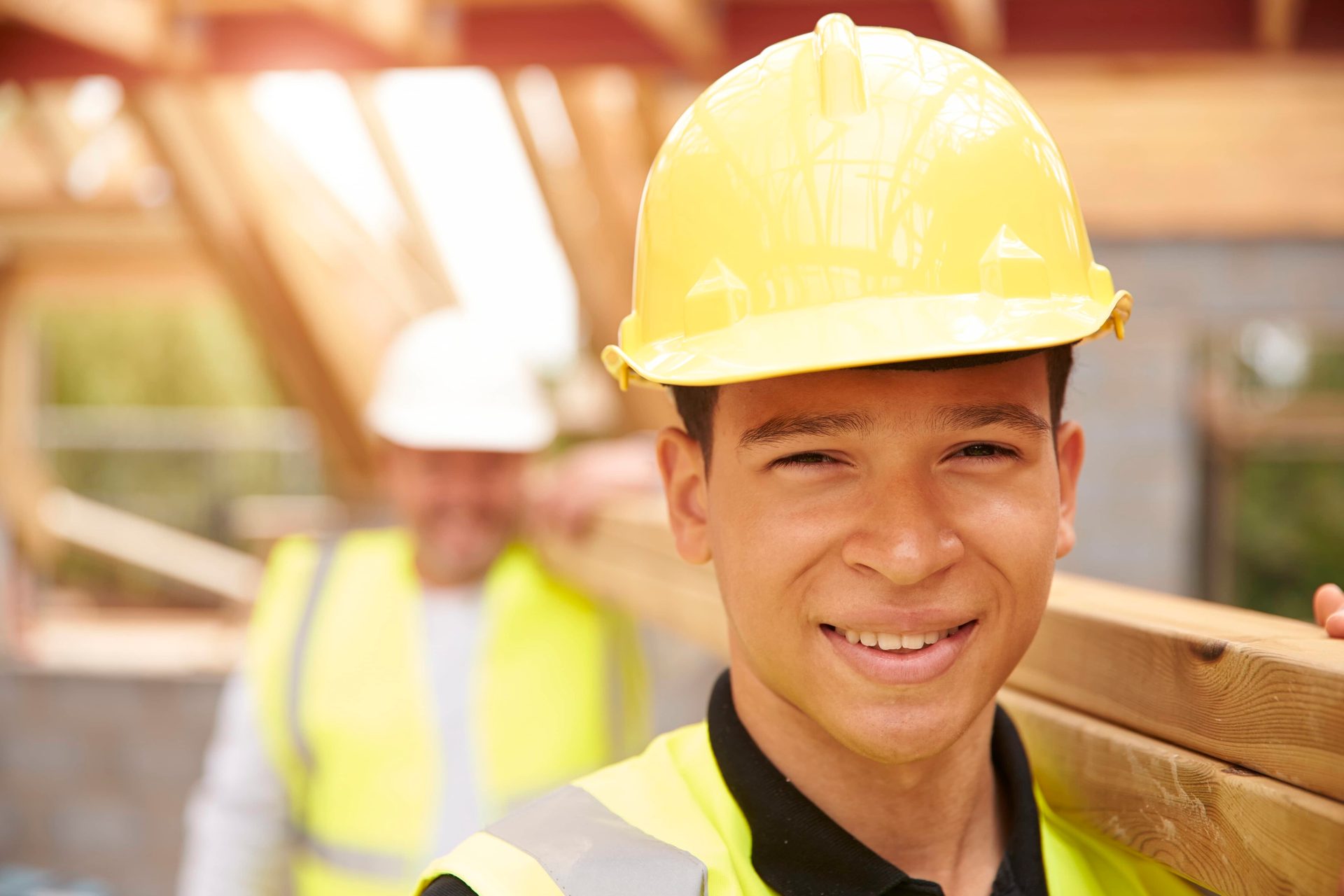 Hard hat, Clothing, Face, Smile, Helmet, Workwear, Sleeve, Engineer, Yellow