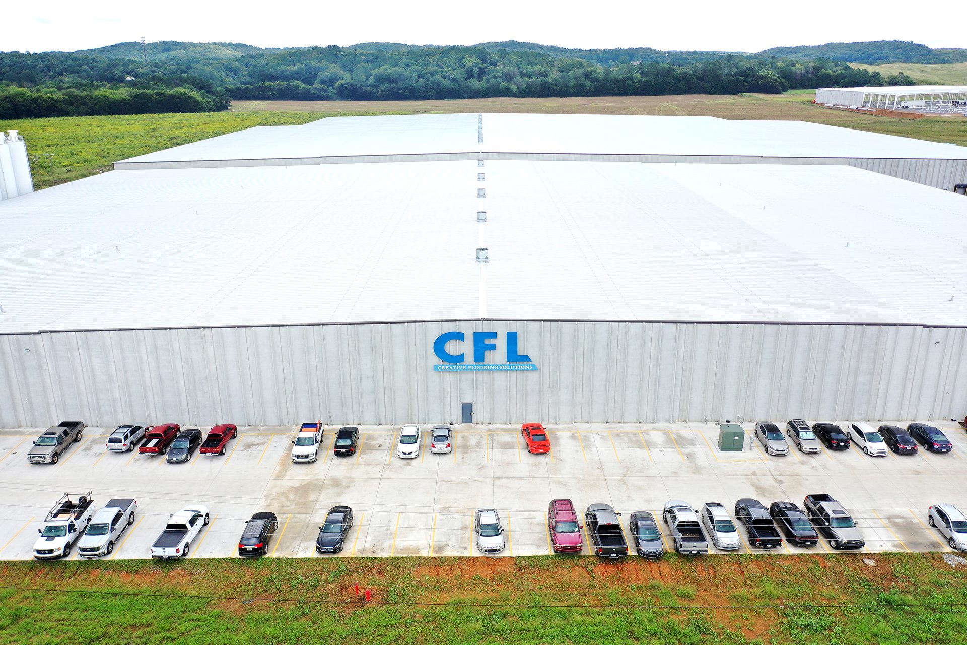 Motor vehicle, Land lot, Automotive exterior, Infrastructure, Grass, Asphalt, Line, Slope