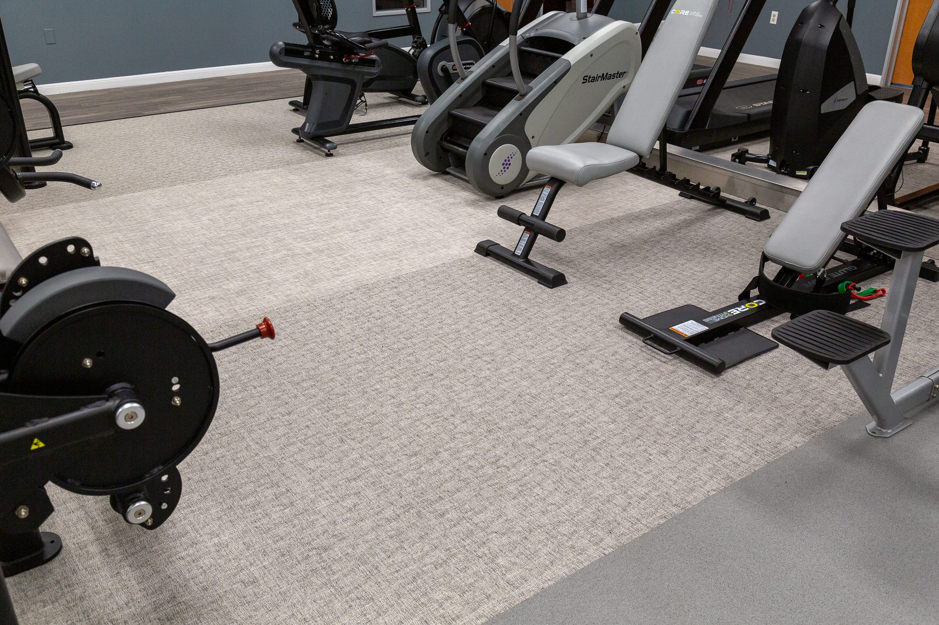 Exercise machine, Motor vehicle, Bicycle tire, Automotive design, Leg, Floor, Flooring, Wheel